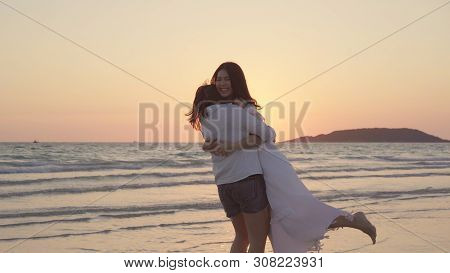 Young Asian Lesbian Couple Running On Beach. Beautiful Women Friends Happy Relax Having Fun On Beach