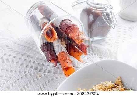 Granola From Several Types Of Cereals With Nuts,coconut Chips And Dried Fruits  In White Plate For B