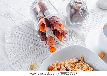 Granola From Several Types Of Cereals With Nuts,coconut Chips And Dried Fruits  In White Plate For B