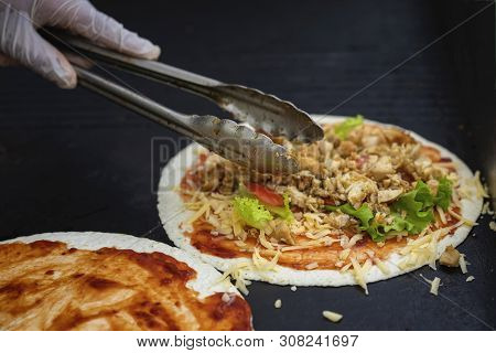 Hands Of Cook In Gloves Preparing Fresh Fajita. Healthy Fresh Tortillas With Grilled Chicken Fillet,