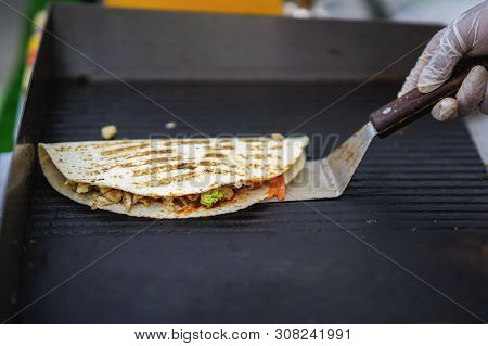 Hands Of Cook Preparing Fajita Wrap With Beef, Chicken And Vegetable Salad. Mexican Food. Party Food