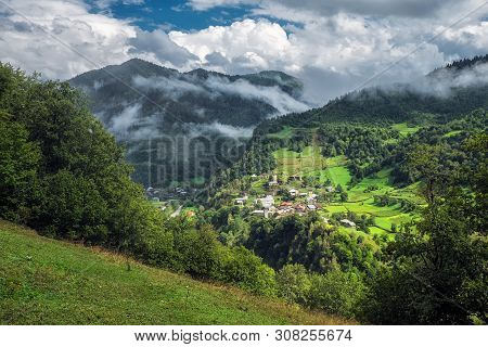 Georgian Landscape Of Svaneti Mountains With Small Village And Svan Towers