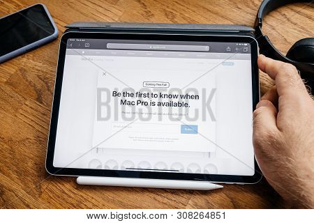 Paris, France - Jun 6, 2019: Man Reading On Apple Ipad Pro Tablet About Latest Announcement - Be The