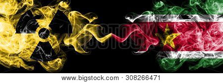Suriname, Surinamese Vs Nuclear Smoky Mystic Flags Placed Side By Side. Thick Colored Silky Smokes C