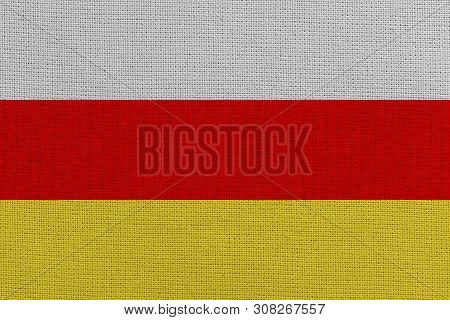 South Ossetia Fabric Flag. Patriotic Background. National Flag Of South Ossetia