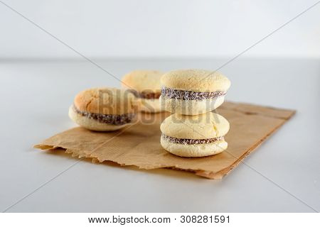 Delicious Argentinian Cookies Alfajores With Cream Dulce De Leche Close-up On The Table. White Vanil