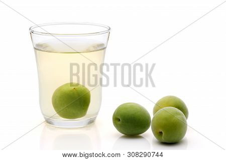 Japanese Plum Wine Called Umeshu On White Background