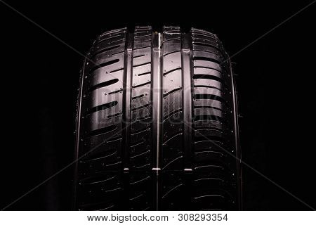 New Summer Tire, Tire Tread. Close-up, Black Background