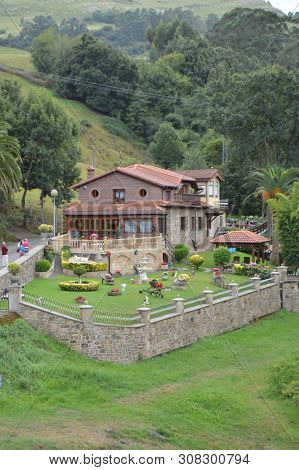 Beautiful House Exquisitely Decorated With Different Plants Next To The River Miera In Lierganes. Au