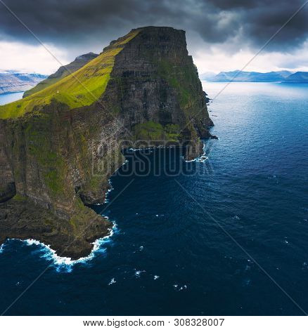 Aerial Panorama Of A Small White Lighthouse Located On The Edge Of A Huge Cliff And The Island Of Ka