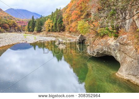 Red Bridge Cross River Among The Autumn Forest In To-no-hetsuri - Shimogo, Fukushima, Japan