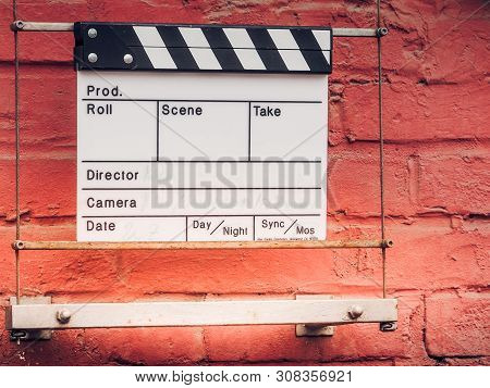 Ciak Or Clap Board On A Wall. Film Movie Titles. Abstract Image For Cinema. Can Be Applied To Concep