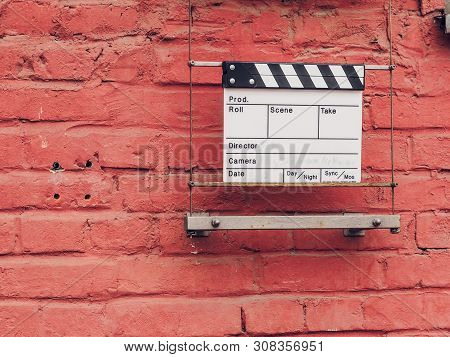 Ciak Or Clap Board On A Wall. Film Movie Titles. Abstract Image For Cinema. Can Be Applied To Concep