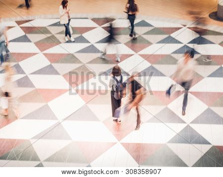 People In Motion At The Modern Shopping Mall.