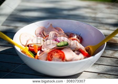 Sausage Salad On Garden Table. Food, Sausage