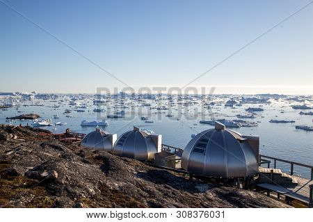 Ilulissat, Greenland - July 3, 2018: The Igloos At Hotel Arctic With View Over The Icefjord.