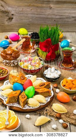 Colored Eggs, Wheat Springs And Sweet Pastry For Novruz Holiday In Azerbaijan. Selective Focus.
