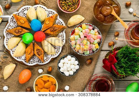 Colored Eggs, Wheat Springs And Sweet Pastry For Novruz Holiday In Azerbaijan. Selective Focus.