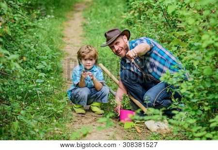 Day Of Earth. Boy And Father In Nature. Gardening Tools. Planting Flowers. Dad Teaching Little Son C