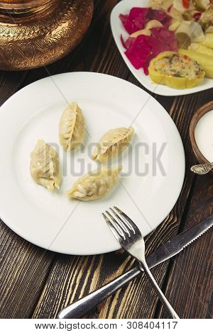 Caucasian Traditional Food, Khinkali,dushbere, Gurze Served With Turshu.image