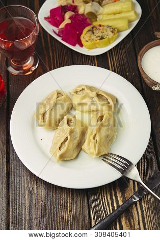 Caucasian Traditional Food, Khinkali,dushbere, Gurze Served With Turshu. Image