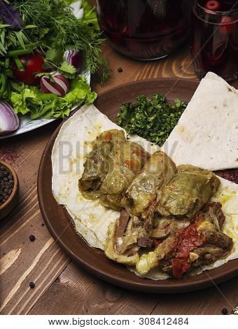 Kelem Dolmasi, Cabbage Leaves Stuffed With Meat And Rice, With Beef Stew With Vegetables In Lavash. 