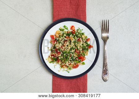 Lebanese Traditional Salad Taboule Made Of Parsley, Mint, Lemon, Tomatoes, Olive Oil, Salt And Peppe