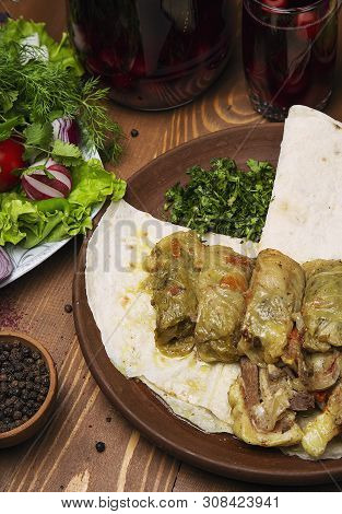 Kelem Dolmasi, Cabbage Leaves Stuffed With Meat And Rice, With Beef Stew With Vegetables In Lavash. 