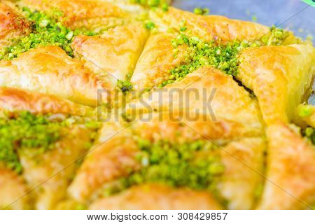 Honey Baklava Kadayif With Nuts Pistatio In The Market. Beautiful Arabic Sweet Background. Selective