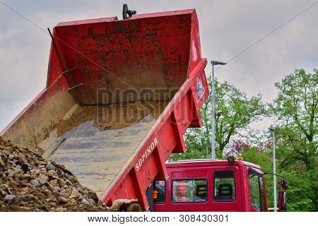 Dump Truck Red Used With A Raised Body Dumps Stones. Luxembourg. April 2019