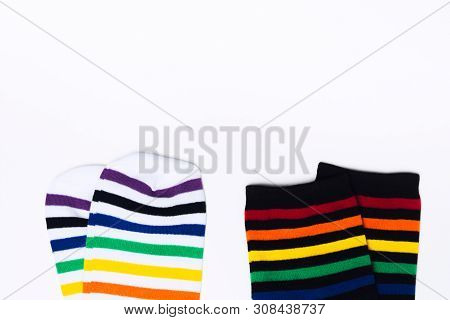Two Clean White And Black Pair Of Socks With Striped Pattern On White Background With Copy Space. Fl