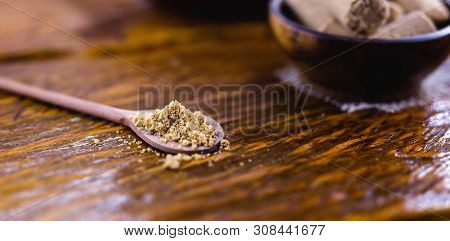Paçoca Ground In A Wooden Spoon, Typical Brazilian Peanut Candy. Food From Brazil Made In The Northe