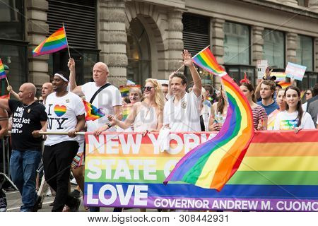 2018 JUNE 24 NEW YORK: Democratic New York Governor Andrew Cuomo and supporters march along the 5th Ave parade route during the NYC Pride March.