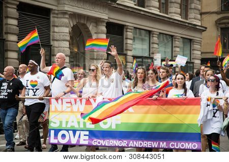 2018 JUNE 24 NEW YORK: Democratic New York Governor Andrew Cuomo and supporters march along the 5th Ave parade route during the NYC Pride March.