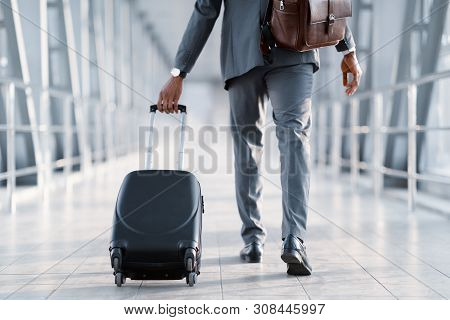 Business Trip. Businessman Carrying Suitcase, Walking Through Passenger Boarding Bridge