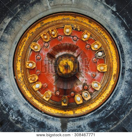 old rusty wheel of haul truck, close-up view