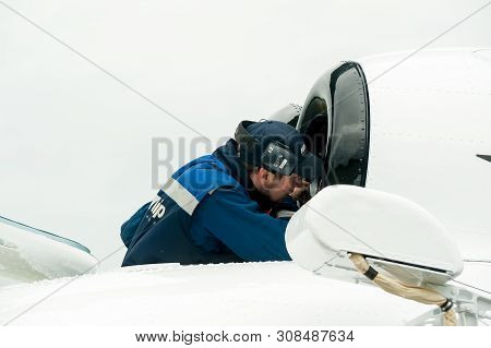 Tyumen, Russia - June 19, 2019: Aircraft Repair Helicopter Utair Engineering Plant. Male Mechanic In