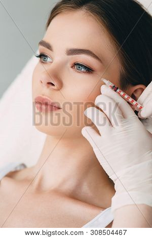 Beauty Injections Into Beautiful Face. Smoothing Of Mimic Wrinkles Around The Eyes Using Biorevitali