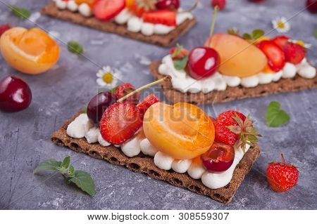 Crisp Bread With Creme Cheese, Fruit And Berries