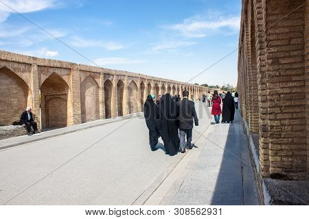 Isfahan, Iran - March 8: People Walk Along Si-o-se Bridge On March 8, 2013 In Isfahan, Iran. Bridge 