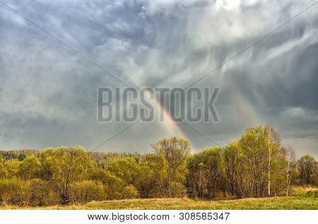 Colorful Double Rainbow On Cloudy Sky Over Forest After Spring Rain - Beautiful Spring Rural Landsca