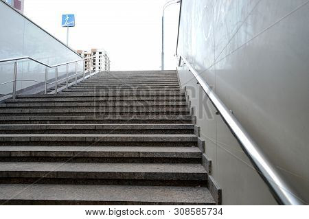 The Modern Exit From The Pedestrian Tunnel Is Empty, Up The Stairs. Staircase Up To The Street From 