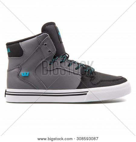 Vienna, Austria - August 25, 2017: Supra Vaider Grey, Black, Turquoise And White Sneaker On White Ba
