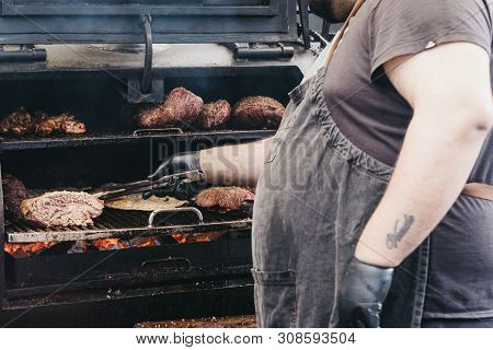London, Uk - June 22, 2019: Staff Preparing Food At A Smokoloco Stall Inside Spitalfields Market, On