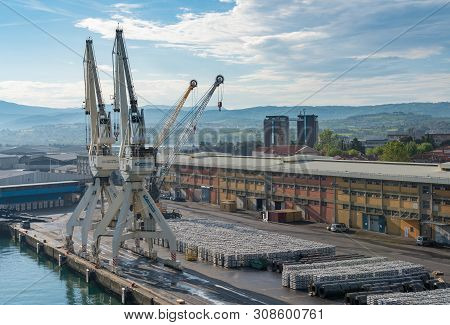 Koper, Slovenia - 24 May 2019: Cranes Line The Quayside In The Port Of Koper In Slovenia