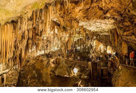 Stalactites And Stalagmites Underground In Cave System In Postojna