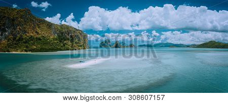 Palawan, Philippines. Aerial Panoramic Scenic Picture Of Sandbar With Lonely Tourist Boat In Turquoi