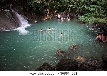 Erawan, Thailand - Aug 25: People Bath In Erawan Waterfall, Thailand On Aug 25, 2013.waterfall Is Na