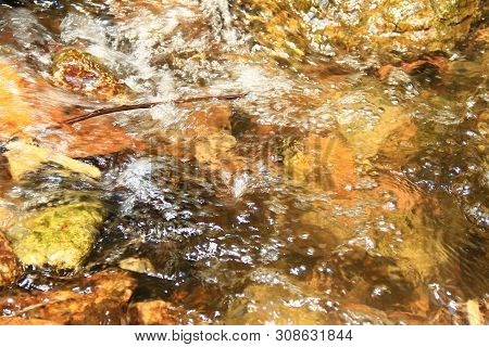 The Clear Water Flows Through The Gravel Are Smooth And Very Cool. Originated From Natural Waterfall