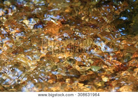 The Clear Water Flows Through The Gravel Are Smooth And Very Cool. Originated From Natural Waterfall
